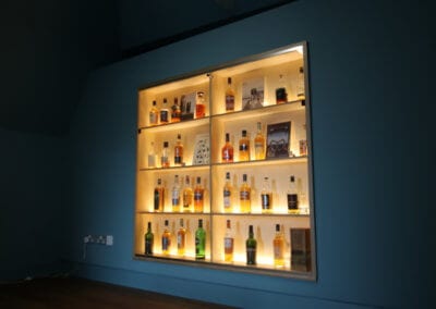 Bespoke glazed presentation cabinet and shelving by Allstar Joinery