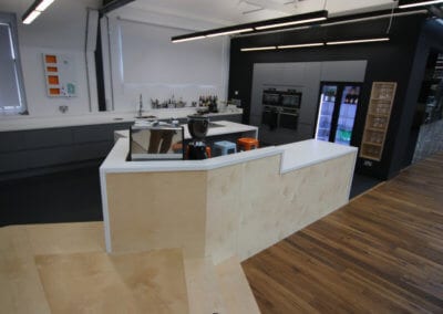 Kitchen work area completely cladded with solid surface Corian� worktops and integrated appliances